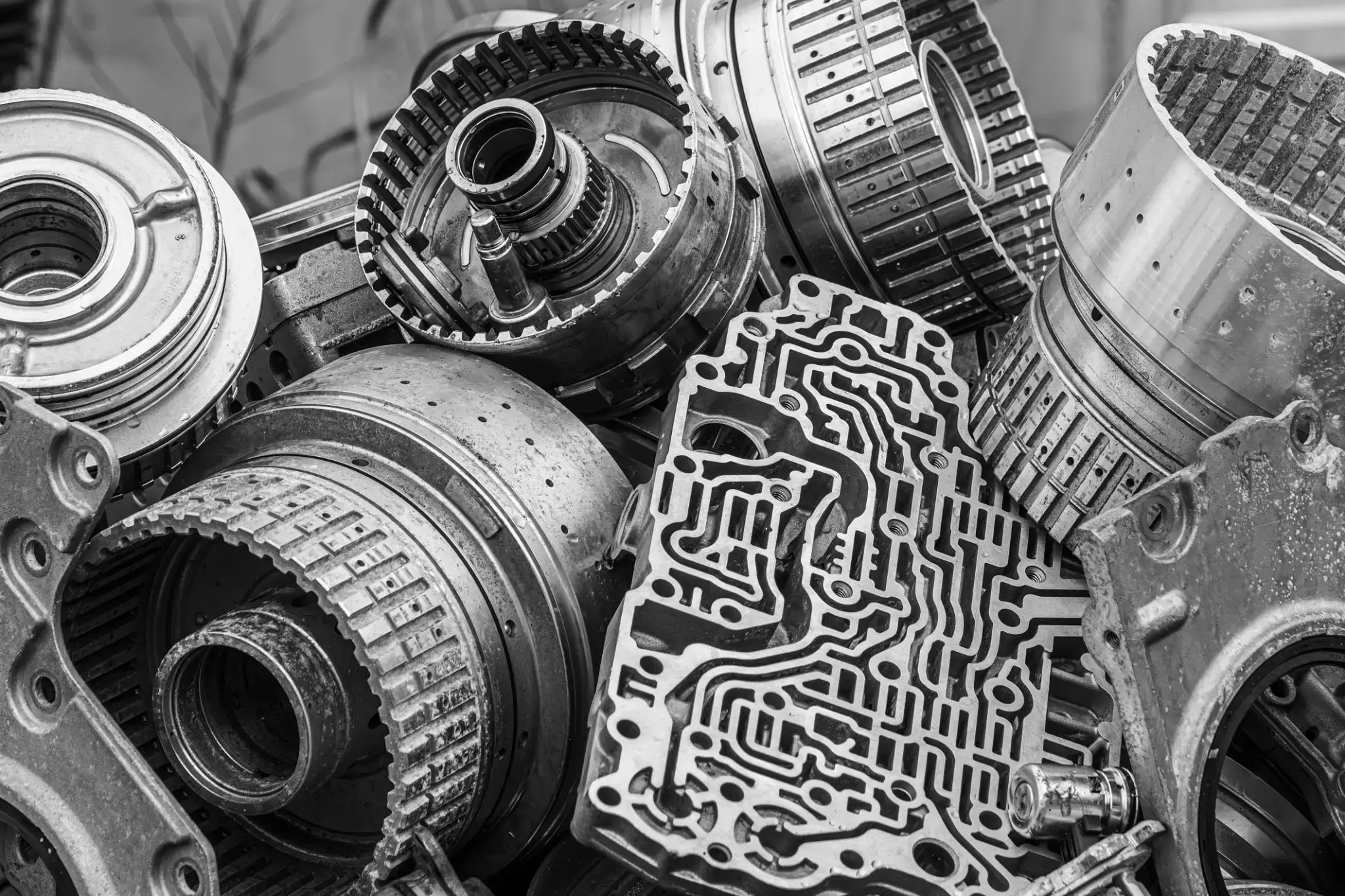 Close-up of mechanical gears and components in black and white.
